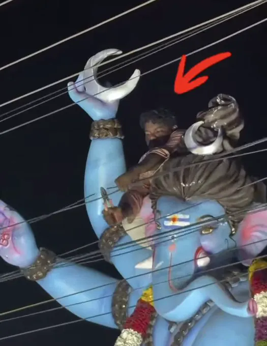 Men climb giant religious idols during processions in India to cut overhead cab… · non aesthetic things
